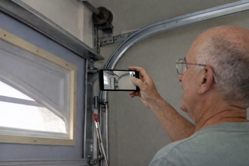 Larry troubleshooting garage door issue over video call